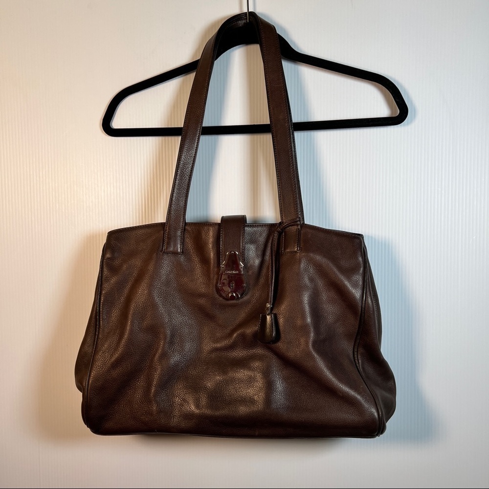CALVIN KLEIN Shoulder bag with clasp closure. Brown pebble leather. Key fob
